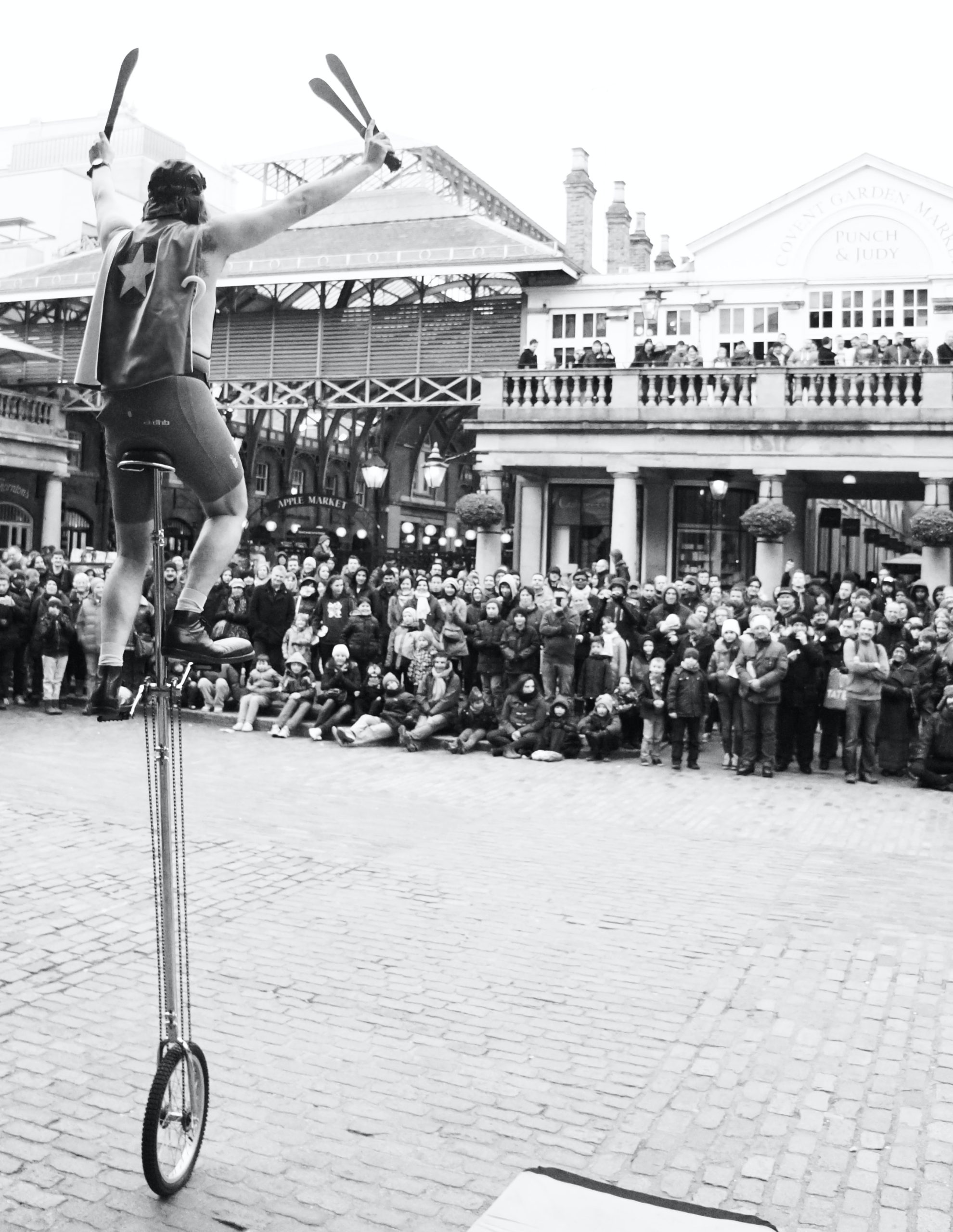 Unicyclist with a large crowd